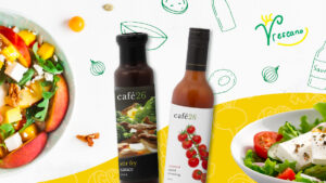 Website migration concept image showing two fresh salad bowls and café26 sauce bottles on a white and yellow background for LivelyGreen branding