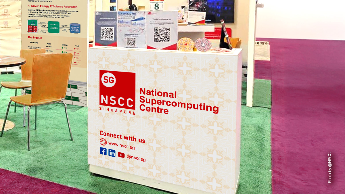 Close-up of NSCC Singapore booth showing red typography against pastel tile background